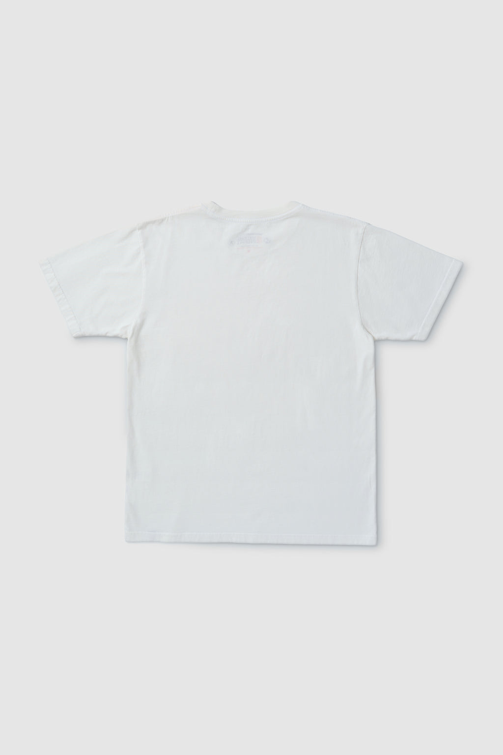 Plain white t-shirt on a light gray background