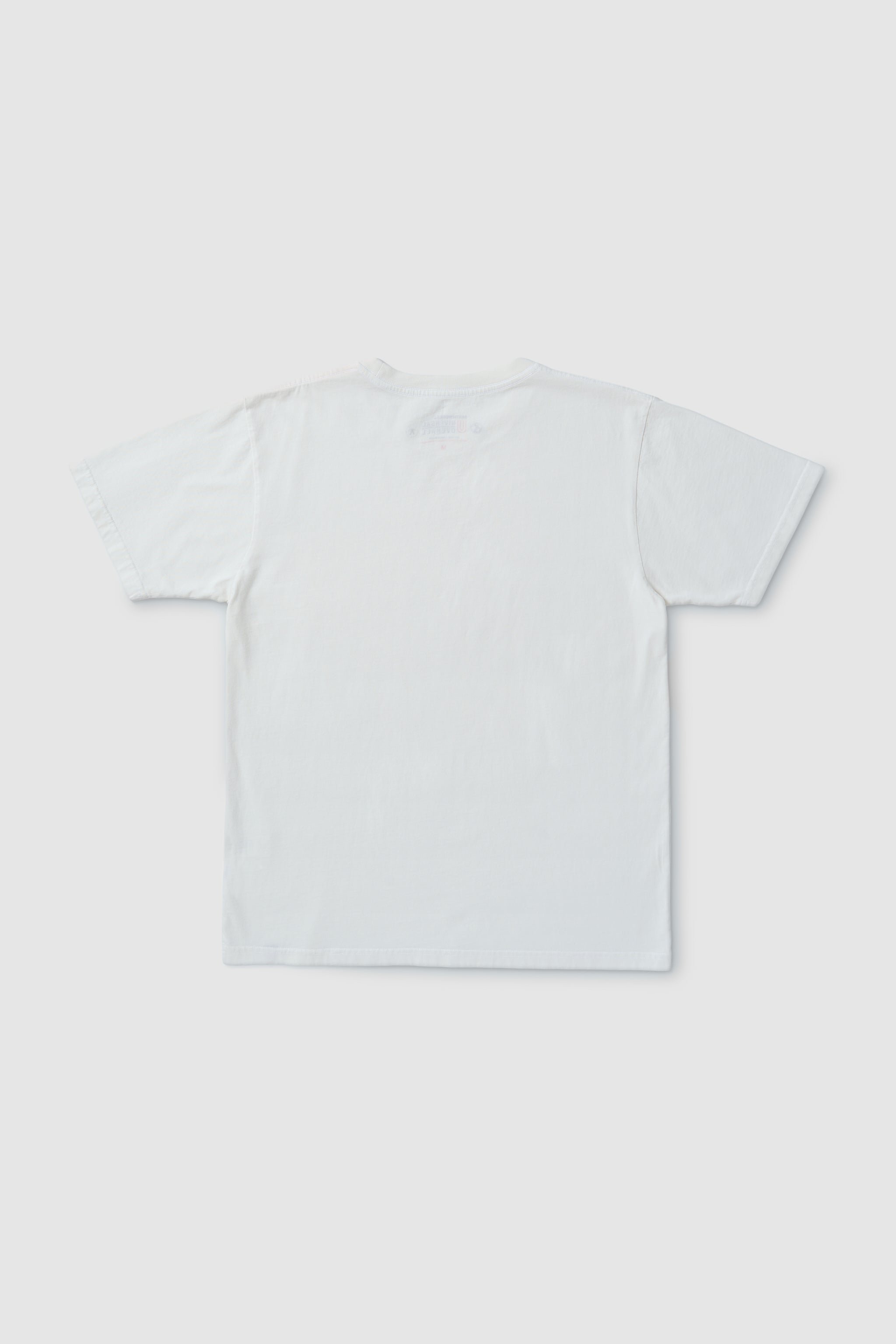 Plain white t-shirt on a light gray background