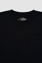 Black shirt with a visible brand logo on a light gray background