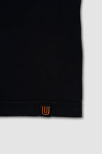 Black sleeve with a small orange logo on a white background