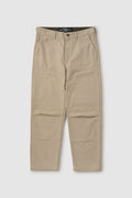 Beige pants with a visible brand label on a white background