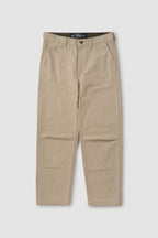 Beige pants with a visible brand label on a white background